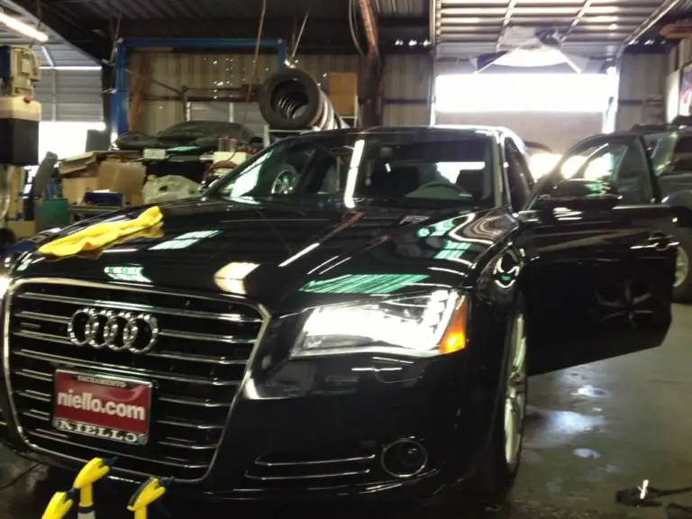 Black Audi A8 with tinted windows in the shop