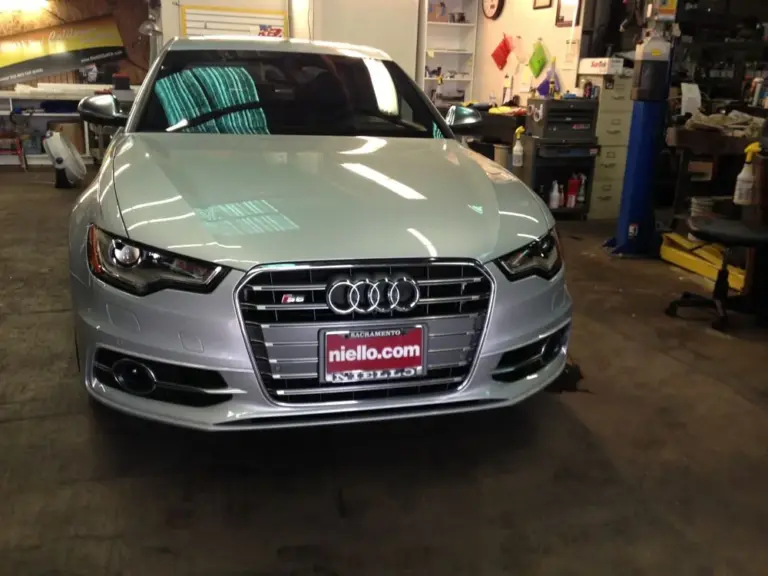 Silver Audi S6, front view, in the shop