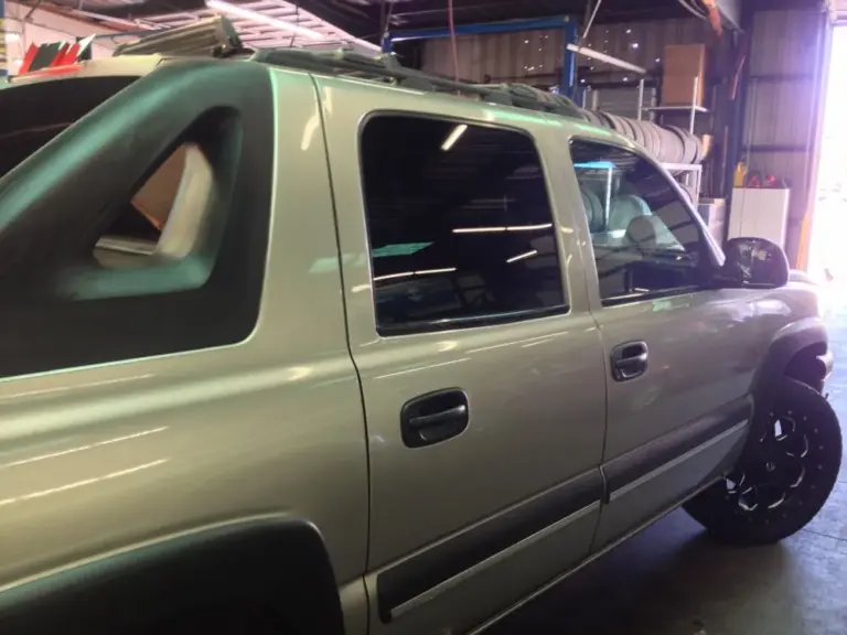 Chevrolet Avalanche with tinted windows in the shop