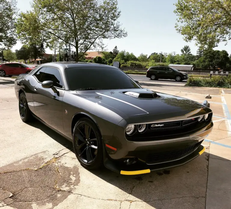 Matte gray Dodge Challenger with dark tinted windows