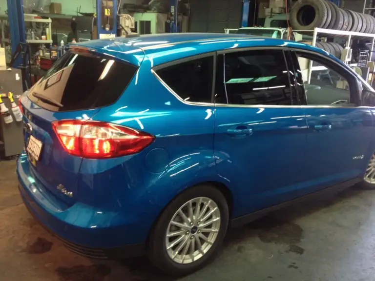 Blue Ford C-Max with tinted rear windows in the shop