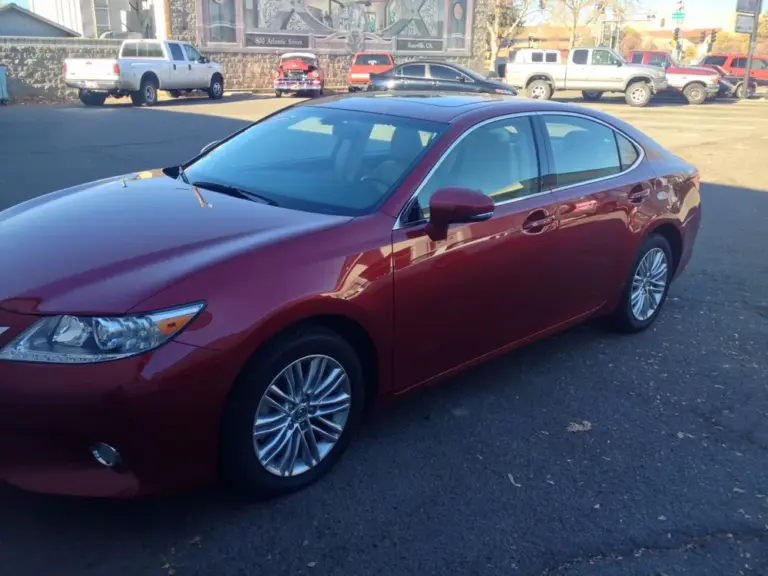Red Lexus ES with tinted windows in a parking lot