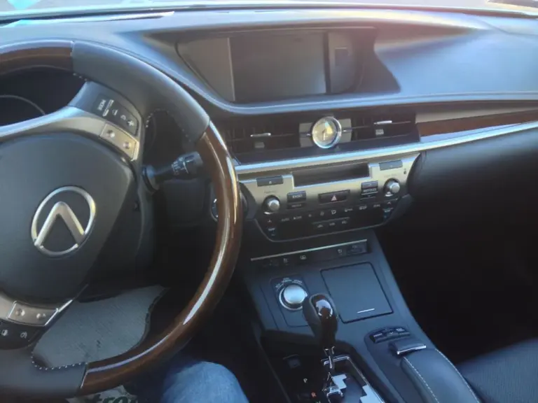 Lexus dashboard and steering wheel in the shade of tinted glass