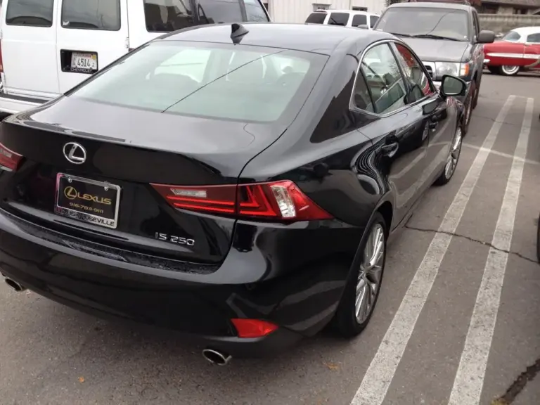 Black Lexus IS 250 with tinted windows, rear view