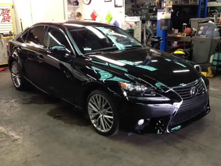 Black Lexus IS F Sport with tinted windows in the shop