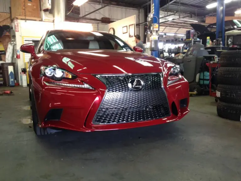 Red Lexus IS F Sport, front view, in the shop