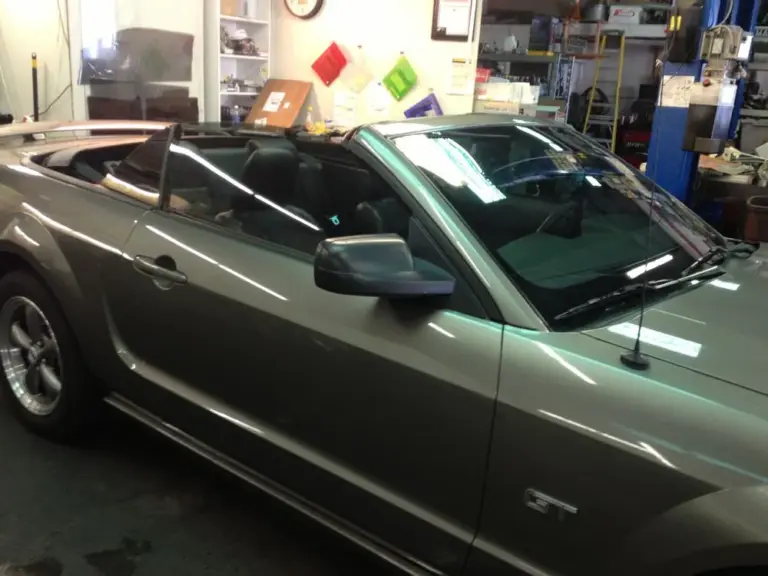 Gray Ford Mustang convertible with tinted windows
